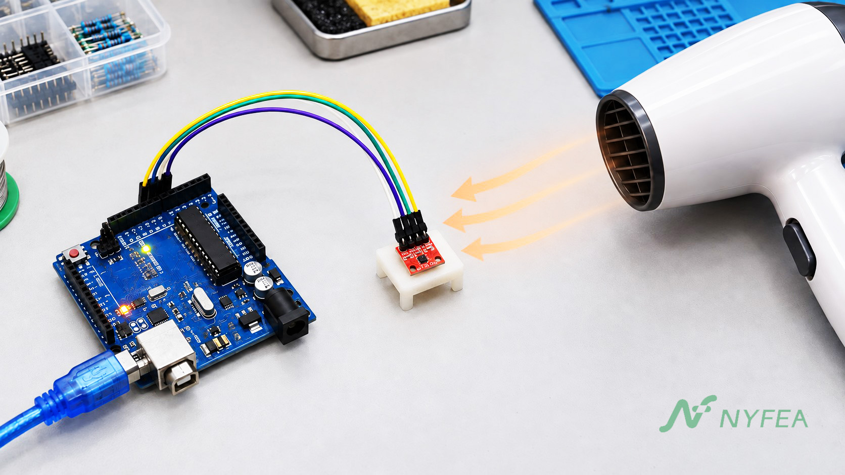 Gentle warm air directed from a hair dryer toward an SHT31 breakout connected to an Arduino Uno