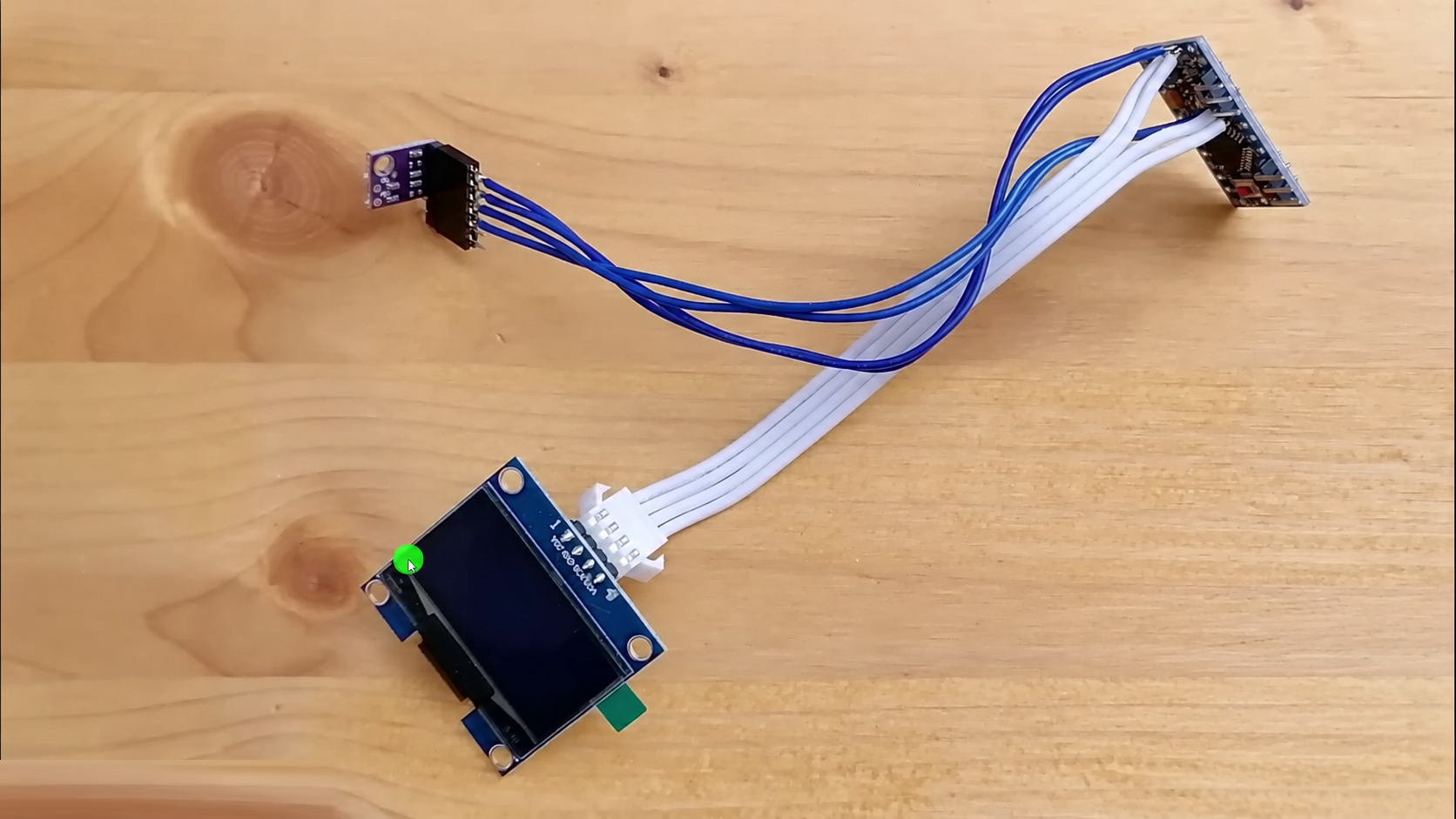 Real SHT31 module connected by four wires to the controller and OLED test assembly