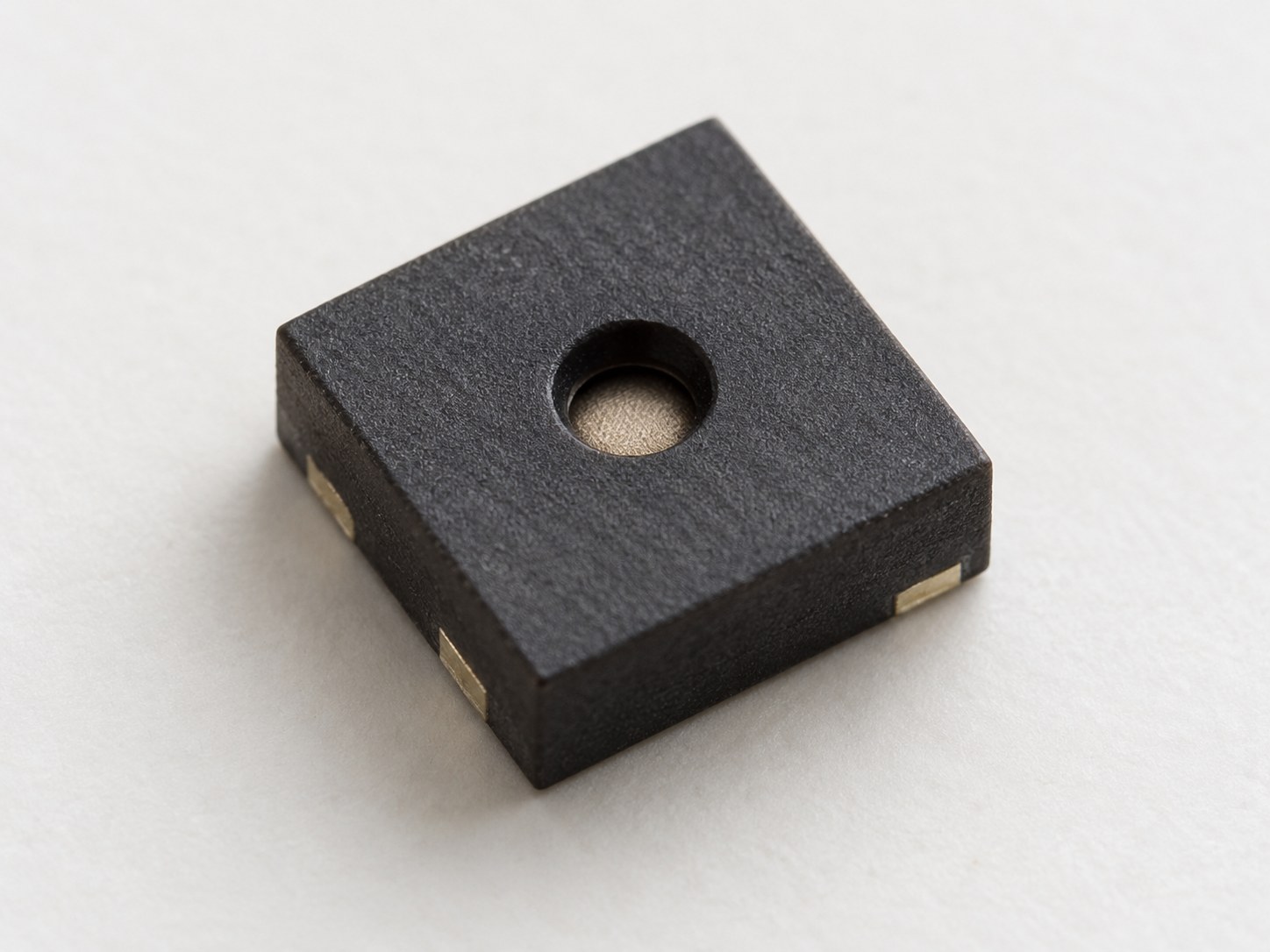 Package-level illustration of a bare four-contact SHT40 sensor with a centered top sensing opening