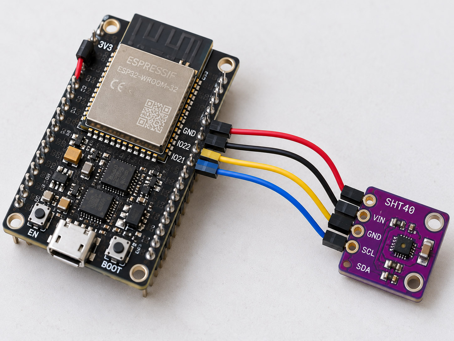 Illustrative ESP32 development board linked to a small SHT40-class breakout