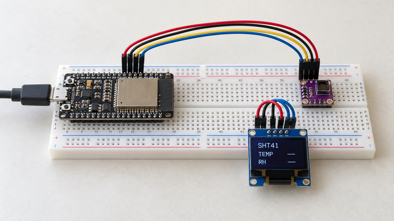 Full breadboard prototype scene with a classic ESP32 board, small SHT41 sensor module and OLED display